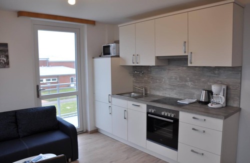 Baltrum Apartment | Sunny island apartment with balcony and close to the beach, 2 bed.