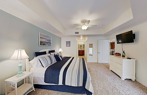 Butler Beach Condo | Sunny Poolside Condo w/ Patio: Hot Tub & Beach Access, Near Shopping & Dining
