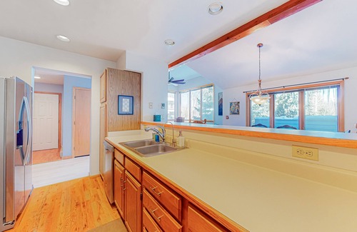 Edwards House | Sunny two-story townhouse with fireplace plus pool, hot tub, sports courts