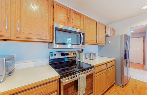 Edwards House | Sunny two-story townhouse with fireplace plus pool, hot tub, sports courts