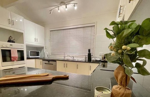 Mount Pleasant House | Sunset getaway with panoramic water & mountain view