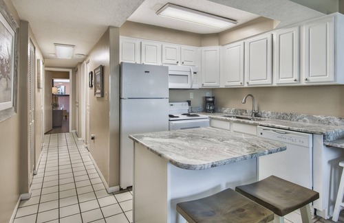 Holiday Isle Condo | SUNSET JETTY VIEW! ENJOY 1 FREE BEACH CHAIR SET UP & UMBRELLA EACH DAY