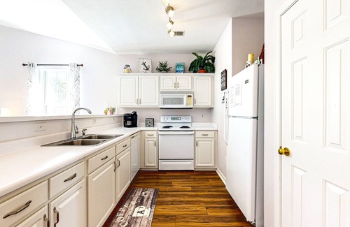 Sunset Beach Condo | Sunset Village top-floor end unit with golf & pond views, pools & hot tub