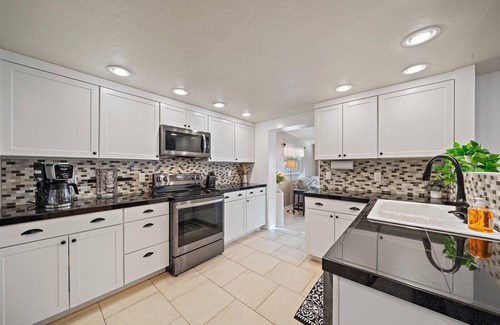 Sarasota House | Sunshine Haven | HUGE Backyard, Private heated Pool + Fire Pit!