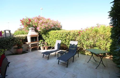 Portiragnes Villa | Superbe villa climatisée, vue réserve naturelle, 7 couchages 3 chambres belle terrasse piscine commune parking dans résidence sécurisée 200m de la plage LRMA52