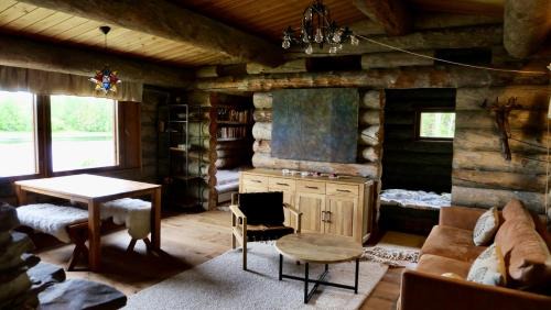 Rovaniemi Ski Chalet | Suvantokoto Riverside Log Cabin