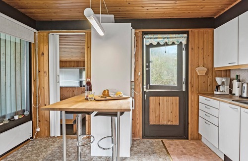 Rodby House | Take advantage of the proximity to the sandy beach in this practical vacation home.