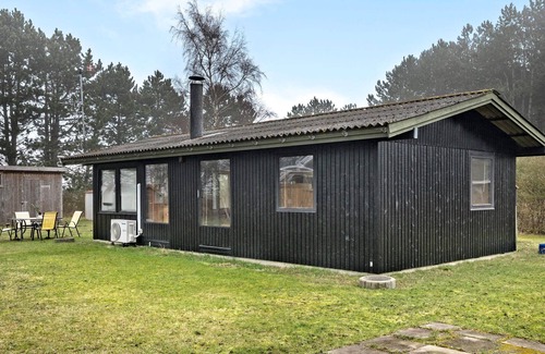 Rodby House | Take advantage of the proximity to the sandy beach in this practical vacation home.