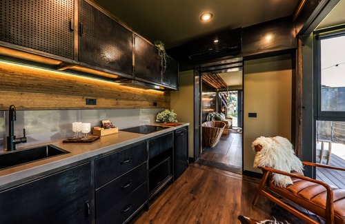 Hepburn Cottage | Teetering over a ravine, with a petrified stone bath older than the dinosaurs