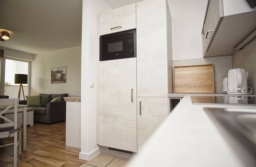 Gohren Apartment | Terrace, free use of the AHOI adventure pool and sauna - Villa Karola FeWo 02