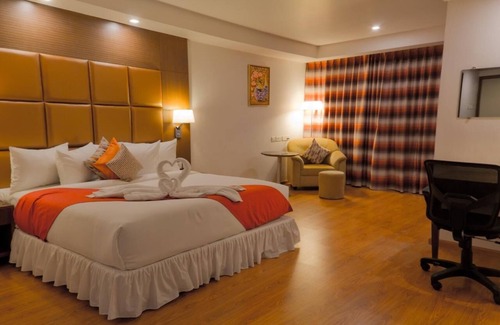 Mysore Hotel | The Atrium Boutique hotel with 1 bedroom and AC, WiFi in charming Mysore