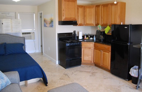 Jacksonville Beach Condo | The Beach Den, Oceanfront poolside studio with kitchen and reserved parking