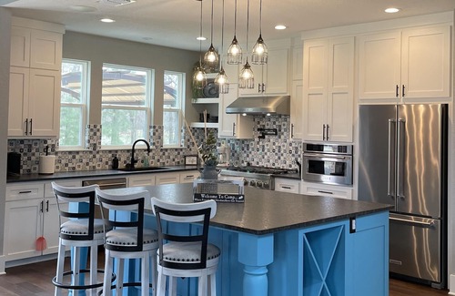 Tyler House | The Blue House on Two Lakes