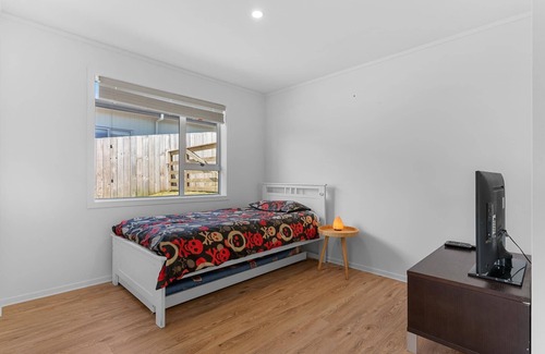 Mangawhai Heads House | The Castle - Modern, sunny, fully fenced holiday home with a lovely rural outlook