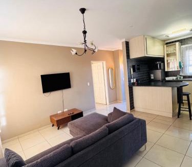 Rand Rifles Apartment | The Coastal Nest - 1 Min from the Beach