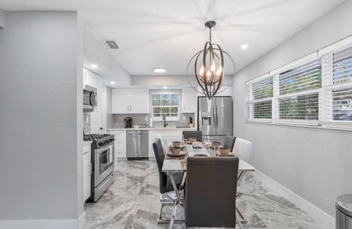 West Palm Beach Villa | The Coral Villa - Heated Pool Spa and Lush Garden