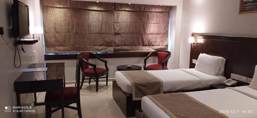 Shanthala Nagar Hotel | The Curzon Court