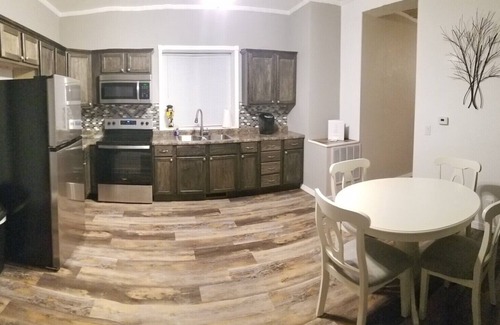 Guttenberg House | “The Depot” 2bedroom “3beds” 1 bath home. Outdoor party area with tv