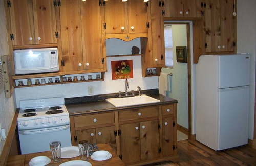 Leander Cabin | The Hideout is a quaint, cozy tiny house/cabin at Round Mountain Ranch