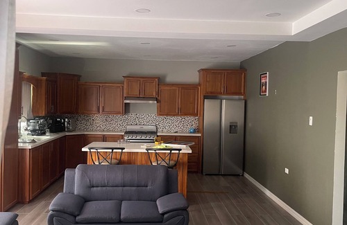 Arouca Apartment | The Home Stay:nCozy 2-bedroom apartment in fantastic La Resource Rd., D'Abadie.