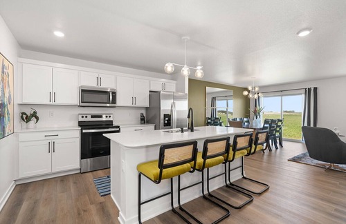 Elkhart House | The House Divided. New Home. Hot Tub. Game Room. Open Concept Living Spaces.