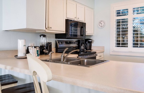 Holiday Isle Condo | The Islander 108 - Complimentary Beach Service - Heated Pool