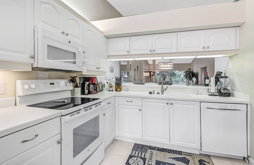 Naples Condo | The LARGEST Tropical Style Pool in S.W. Florida! GORGEOUS lake view!