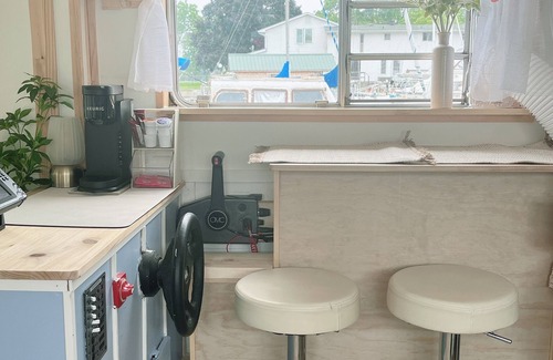 Belleville Boat Rental | The Lilypad: PEC Retreat Waterfront Houseboat Experience Fishing & Glamping