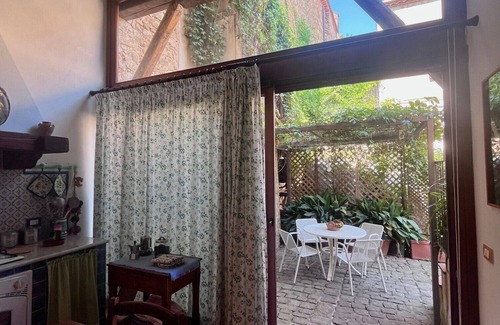 Castelbuono House | The Little House in the Courtyard, cozy vacation home with private courtyard in the center