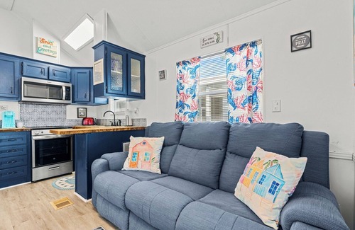 Upper Grand Lagoon House | The Little Love Bug: 2-pup friendly, golf cart, screened porch, near beach/pool