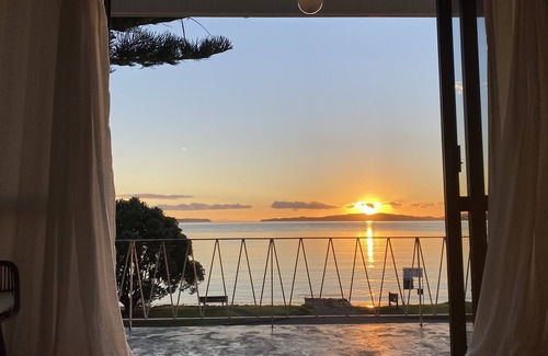 Snells Beach House | The Peach on the Beach! Pick up the paddle board and go!