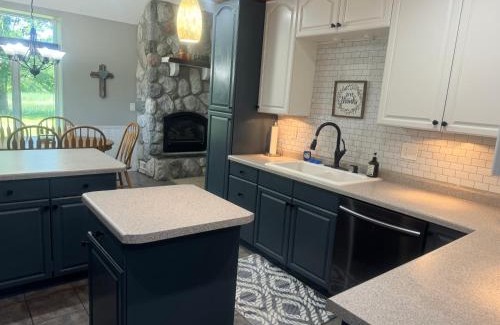 Squaw Lake Resort | The River Condos Hot Tub Fireplace Family & Pet Friendly River Front 2 to 6 bedroom condos dock