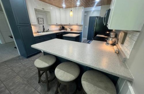 Squaw Lake Resort | The River Condos Hot Tub Fireplace Family & Pet Friendly River Front 2 to 6 bedroom condos dock