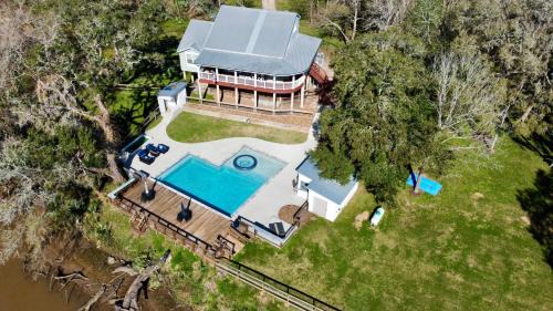 Cedar Lane House | The San Bernard River waterfront provides private access to a spa, boat ramp, and jet skiing