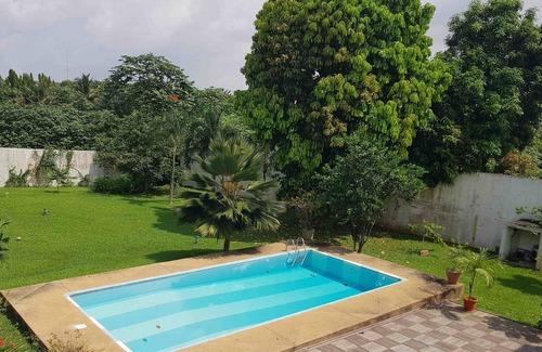Angre House | The Smart House is a family home, in the heart of a lush garden,