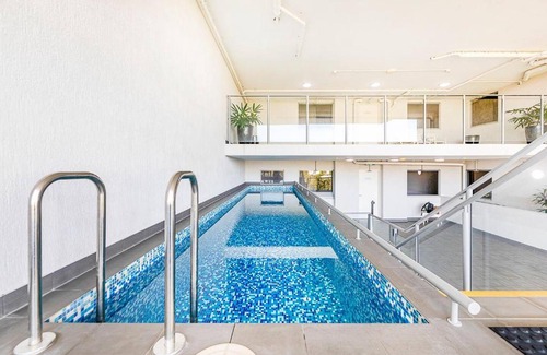 Darwin City Centre Apartment | 'The Smith' A Vibrant Poolside Balcony Haven