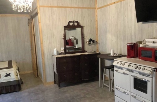 Bryson Cabin | The Stage Coach Cabin is a rustic cabin that sleeps 4.