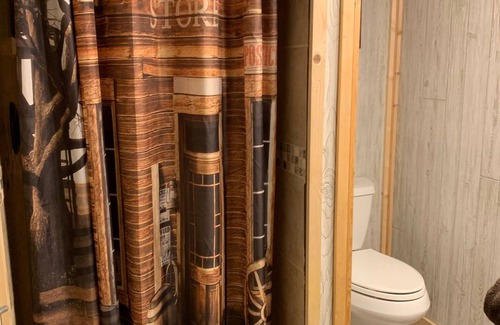 Bryson Cabin | The Stage Coach Cabin is a rustic cabin that sleeps 4.