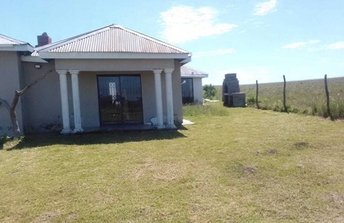 Willowvale Other | The sunrises above the sea, a stretch of a farm and moving ships in the Ocean