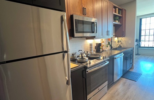 Downtown Dallas Apartment | Theatre Suite ~ City Views ~ Secret Game Room ~
