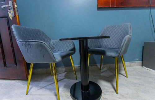 Soroti Apartment | Then Den Soroti White & Gray