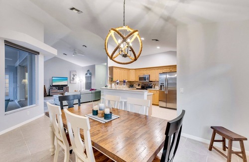 Central Naples House | This 3/2 home enjoys a Southwest facing lakefront view with pool and spa