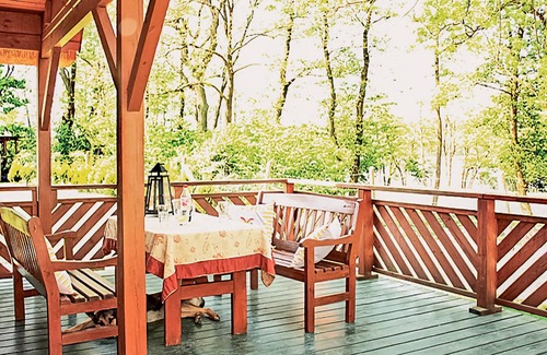gmina Wolin House | This beautiful, well-maintained wooden house is located on a large, fenced lot.