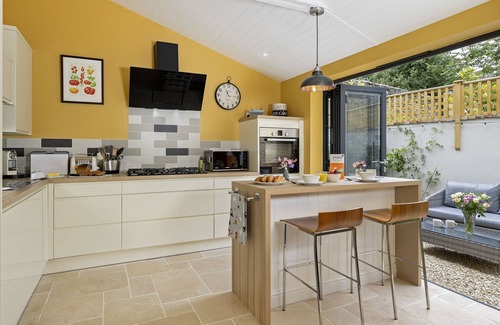Minchinhampton Cottage | This charming Cotswold stone cottage, elegantly furnished with a seamless blend of antique and conte