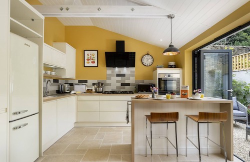 Minchinhampton Cottage | This charming Cotswold stone cottage, elegantly furnished with a seamless blend of antique and conte