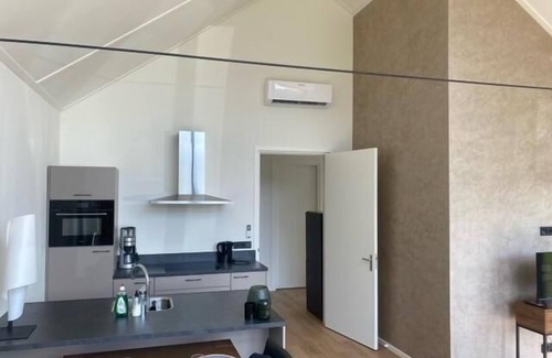 Gasselte House | This modern vacation home is the place to be. The house is suitable for four people, has two bedrooms and is completely on one level. Around the house is a spacious garden to relax in the sun.