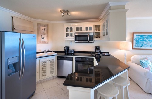 Reeds Bay Condo | This Penthouse is situated directly on a beautiful sandy beach and has a wonderful roof deck terrace
