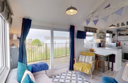 Hayle Apartment | This snug chalet is just a short walk from three miles of sandy surf.