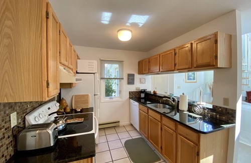 Brewster Condo | This spacious Billington Village condo features updated kitchen and 2 BRs plus a loft sleeping area.