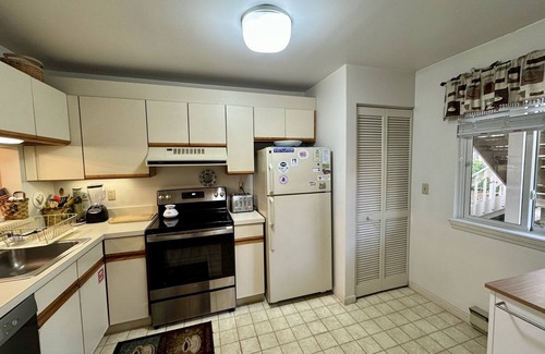 Brewster Condo | This Sunny, End Unit Apartment in Eaton Village Features a Nice Tree-lined View.